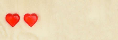 Two love similar valentine day hearts on sweet sugar background.の写真素材