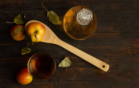 Vegetarian apple composition on rustic wooden background.
