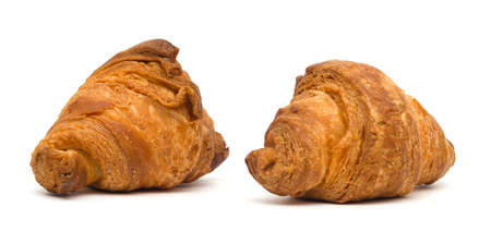 two small croissants isolated on a white backgroundの写真素材