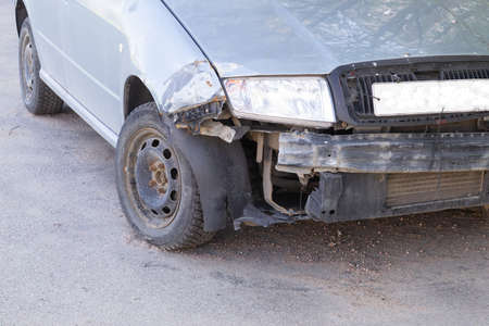 small damage to the front of the car as a result of a road accidentの写真素材
