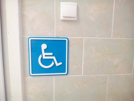 Handicap sign showing place for toilet symbolizing disability and mobility problems showing accessibility and safetyの写真素材