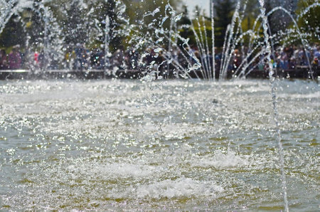 Water splashes from fountain on dark background.Water texture.の写真素材