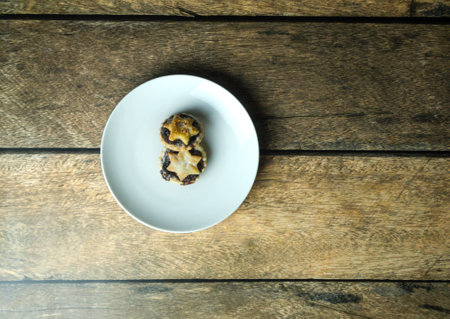 Two traditional british mince pies on a plate for Christmas, top view.の写真素材