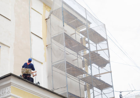 Worker at height on a building construction site.の写真素材