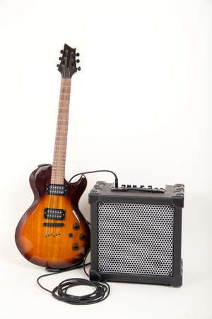 guitar and aplifier with cable, on whiteの写真素材