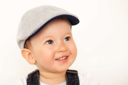 happy baby boy with hatの写真素材