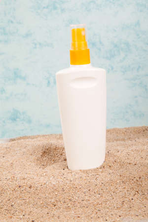 suntan spray on the sandの写真素材