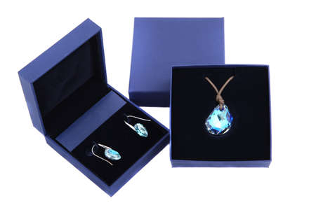 blue stone pendant and earring in blue present box isolatedの写真素材