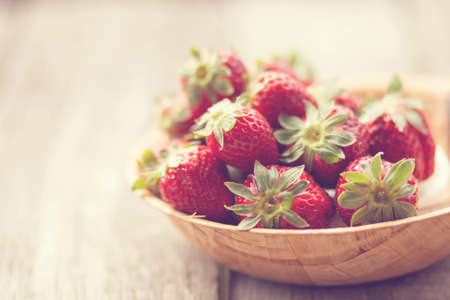 Strawberries in a basket in the gardenの写真素材