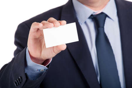 Businessman shows business card, shallow dept of field, isolatedの写真素材