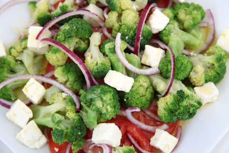 Close up of broccoli salad with tomatoes and cheeseの写真素材