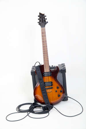 guitar and amplifier with cable, on whiteの写真素材