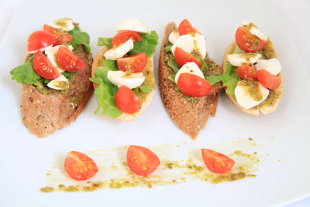 tapas with mozzarella and  cherry tomatoesの写真素材