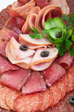 plate of salami, meat delicatessenの写真素材