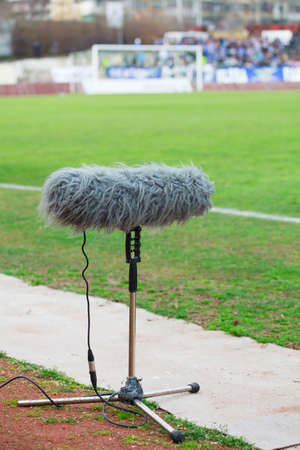 large microphone boom for tv at a football stadiumの写真素材