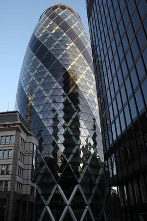 LONDON - JANUARY 31 - 2011: The famous London Gherkin tower- january 31, 2011 in London. the tower is 180 metres tall, and stands on the former site of the Baltic Exchange buildingのeditorial素材