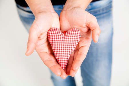 woman hands holding a heart