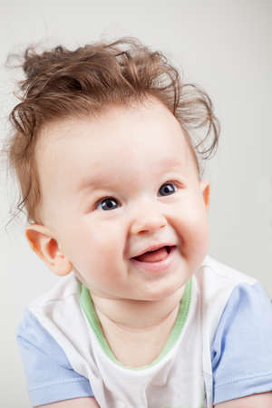 cute smiling baby with funny hair