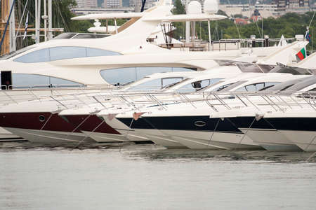 moored luxury yachts stand on an anchorの写真素材