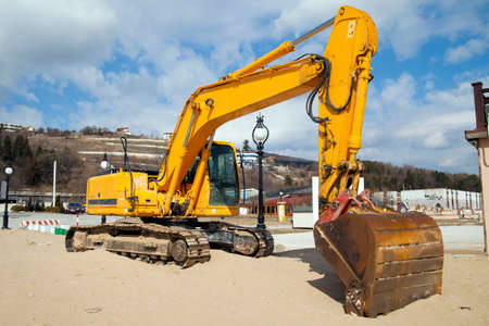 An excavator working in a beachのeditorial素材
