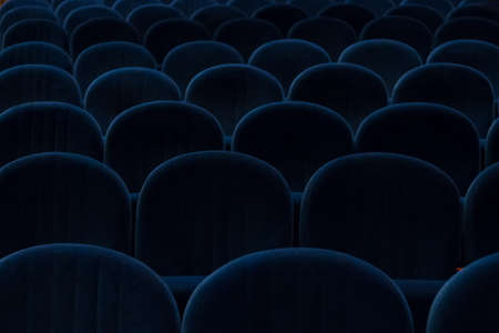 empty blue cinema or theater seatsの写真素材