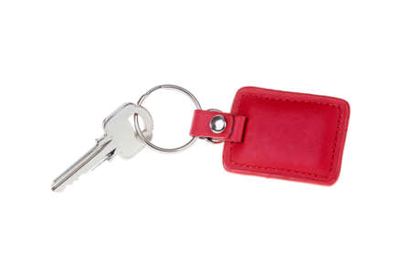 key with red Leather keychain isolated on whiteの写真素材