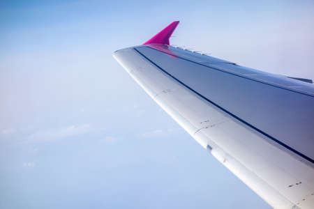 Wing of airplane flyingの写真素材