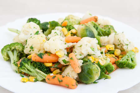 cooked vegetables in white plateの写真素材