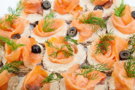 Party platter of bite size smoked salmon appetisersの写真素材