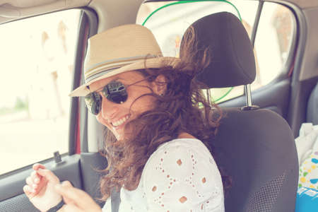 happy woman having fun in the car. Dancingの写真素材