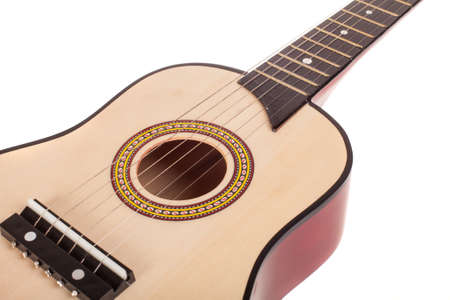 Acoustic guitar bridge and strings close up, isolated