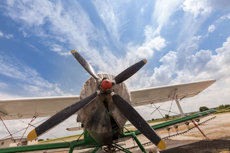 old airplane against a cloudy sky