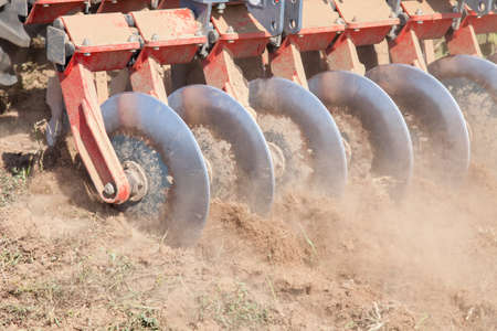 Close up of a disc harrow system, cultivate the soilの写真素材