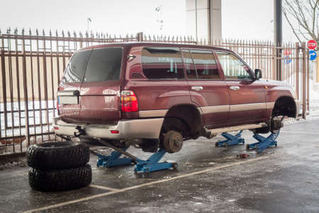 tires of big SUV being changed at the car service shop. Winter tyresの写真素材
