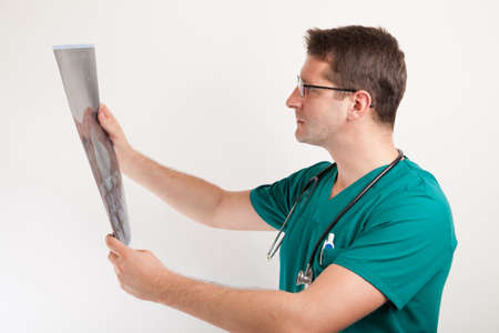 Medical specialist examining patients x-ray