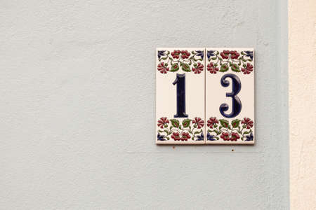 house number thirteen, sign at the wall