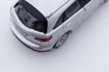 Silver gray SUV car on snow. From above