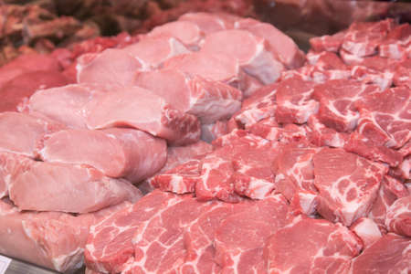 Close up of various meat in a supermarket. Raw meat at butcher shop