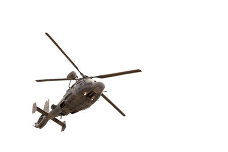 Military helicopter in flight, isolated on whiteの写真素材
