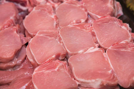 Close up of meat in a supermarket. Raw meat at butcher shopの写真素材