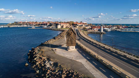 Old windmill at the entrance to the Old Town of Nessebar, ancient city on the Black Sea coast of...