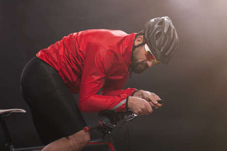 Cyclist in red jacket riding the bike. Extreme sport concept.の写真素材