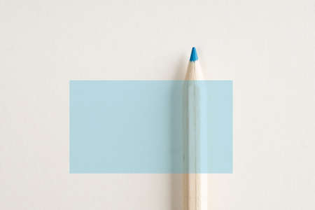 Close up of wooden blue pencil with vertical blue rectangle and copy space.の写真素材
