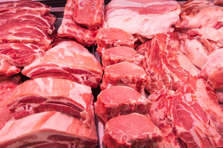 Close up of meat in a supermarket. Raw meat at butcher shopの写真素材
