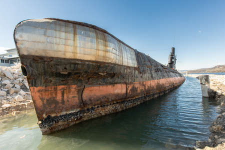 An abandoned, rusty old soviet union submarine in Bulgariaの写真素材