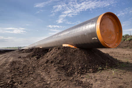 Gas and oil pipeline construction. Pipes welded together. Big pipeline is under construction.の写真素材