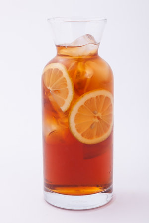 jar glass of iced tea with lemonsの写真素材