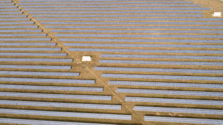 Aerial shot of photovoltaics solar farm. Solar farm power station from above. Ecological renewable...