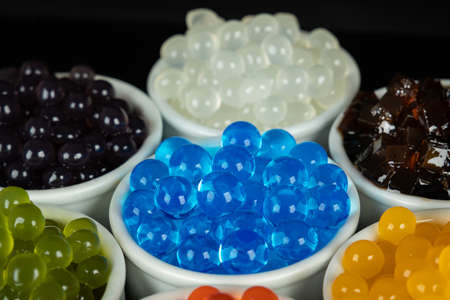 Different tapioca pearls for bubble tea.  Bubble tea ingredients arrangement in bowlsの写真素材