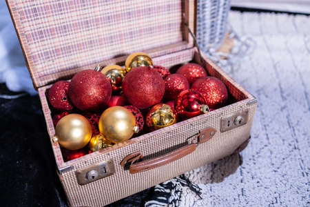 Christmas toys in an open old suitcase. Christmas background, Christmas card, Christmas wallpaper.の写真素材